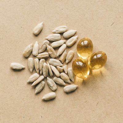Vitamin E capsules with sunflower seeds